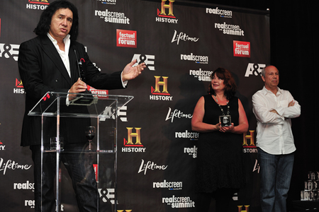 Gene Simmons is inducted into the Factual Entertainment Awards Hall Of Fame by Realscreen's Claire Macdonald (right) and A&E's Bob Debitetto (far right). (C) 2011. Photo: Rahoul Ghose Gene Simmons is inducted into the Factual Entertainment Awards Hall Of Fame by Realscreen's Claire Macdonald (right) and A&E's Bob Debitetto (far right). (C) 2011. Photo: Rahoul Ghose