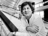 Copied from Playback - 19931002 S4 - Live Entertainment's Garth Drabinsky, at rest for a moment at the bottom of the main staircase at the North York Performing Arts Centre.