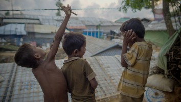 Kids Play with Slingshot